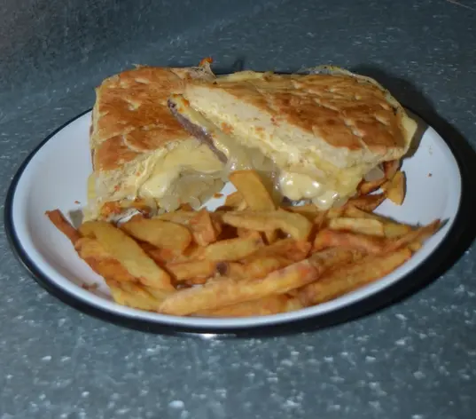 Lomito cebollado al graten